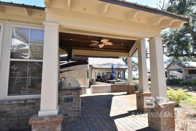 view of patio / terrace featuring a grill and exterior kitchen