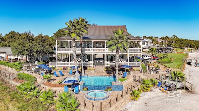 community pool with a patio area and stairway