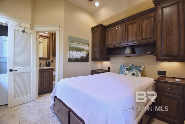 bedroom featuring recessed lighting, stone finish flooring, lofted ceiling, and connected bathroom