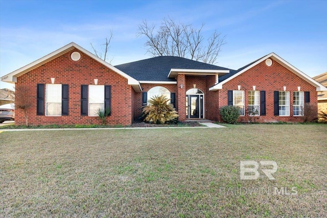 ranch-style home featuring a front yard