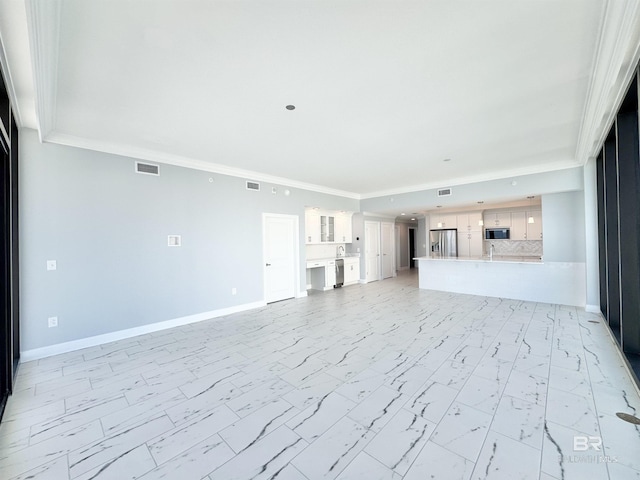 unfurnished living room featuring visible vents, baseboards, marble finish floor, and crown molding