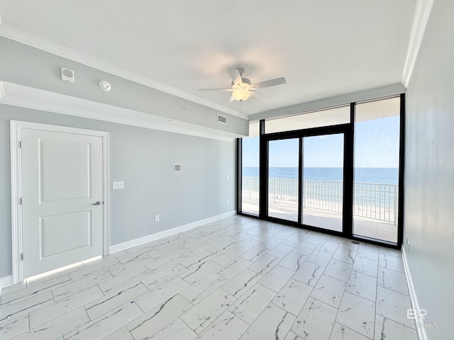 empty room with visible vents, baseboards, ceiling fan, floor to ceiling windows, and marble finish floor