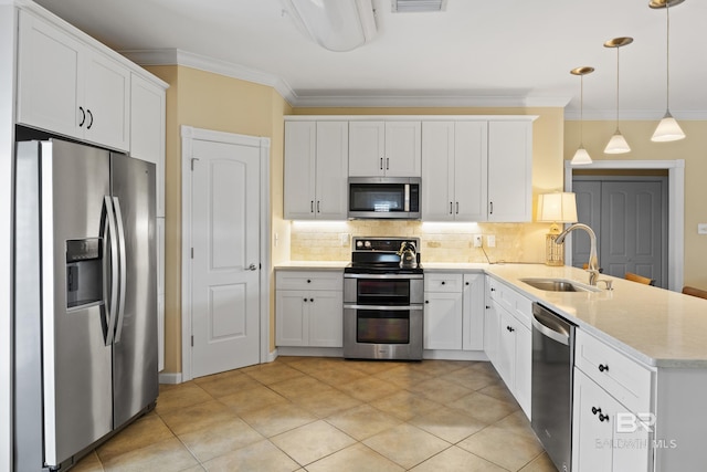 kitchen featuring sink, tasteful backsplash, white cabinetry, decorative light fixtures, and stainless steel appliances