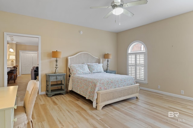 bedroom featuring ceiling fan and light hardwood / wood-style flooring