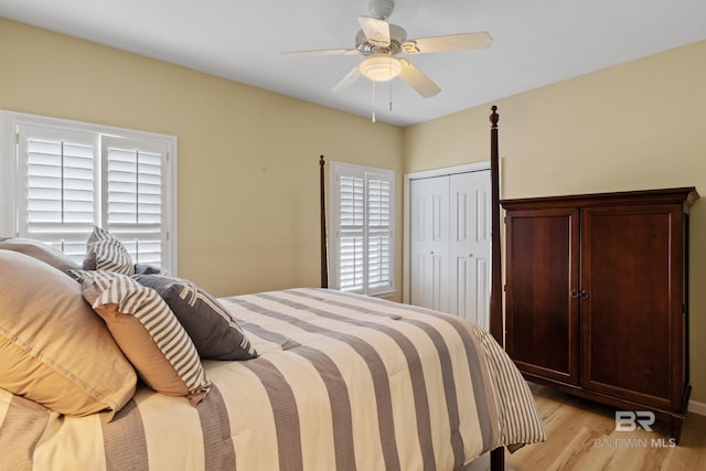 bedroom featuring a closet, ceiling fan, and light wood-type flooring