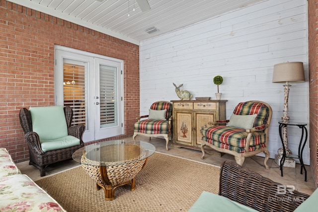 interior space with french doors and ceiling fan