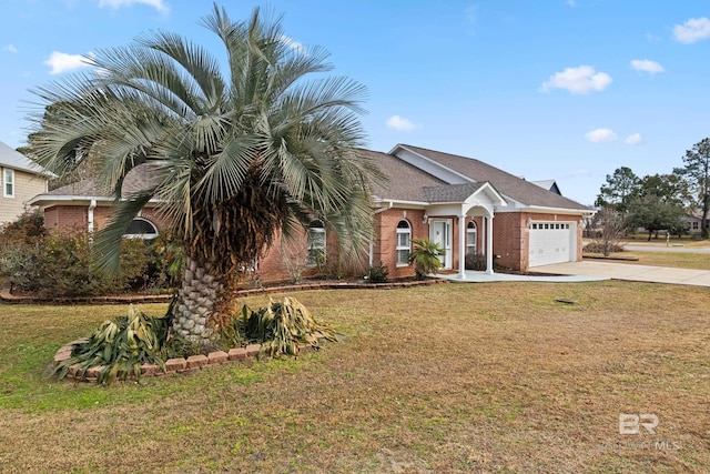 view of front of property with a garage and a front lawn