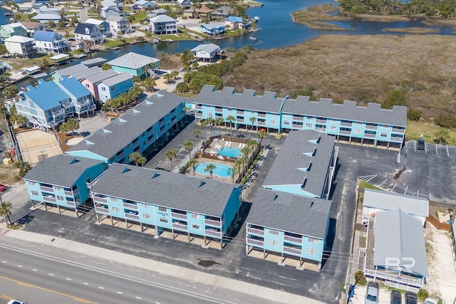 bird's eye view with a water view and a residential view