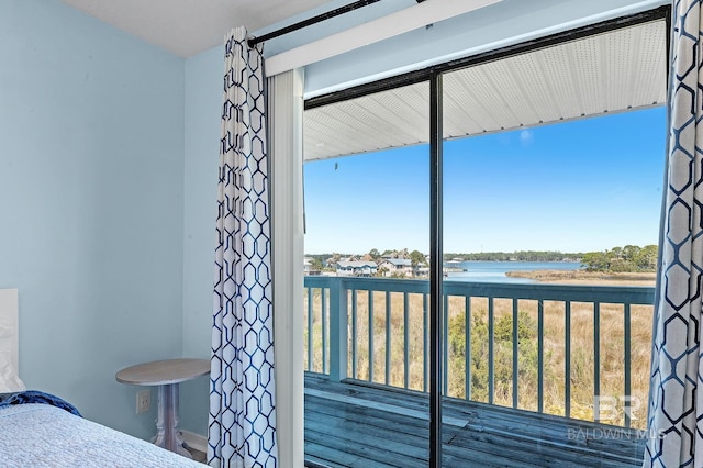 unfurnished bedroom featuring a water view