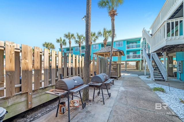 view of patio / terrace featuring stairs and a grill