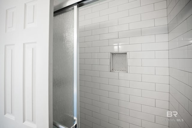 bathroom featuring a stall shower