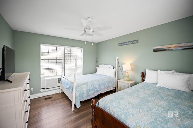 bedroom with dark wood-style floors and ceiling fan