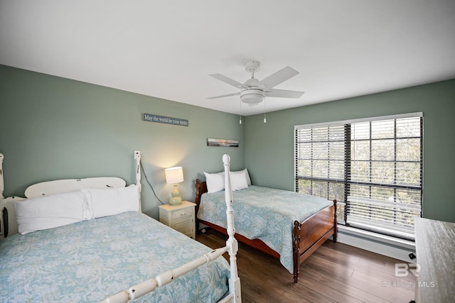 bedroom with wood finished floors and a ceiling fan