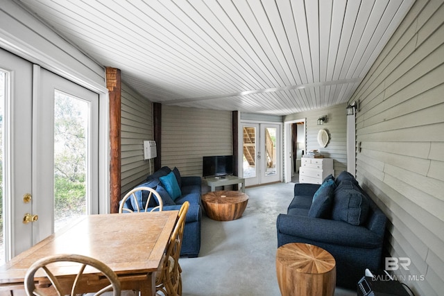 sunroom featuring french doors and healthy amount of natural light