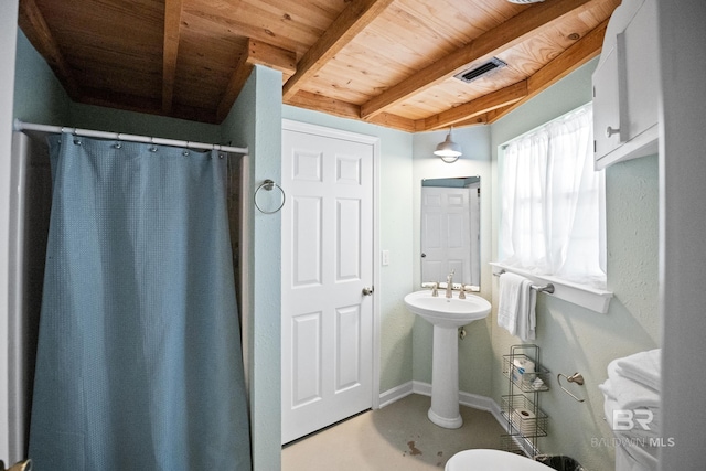 bathroom with wooden ceiling, beamed ceiling, a shower with shower curtain, and baseboards