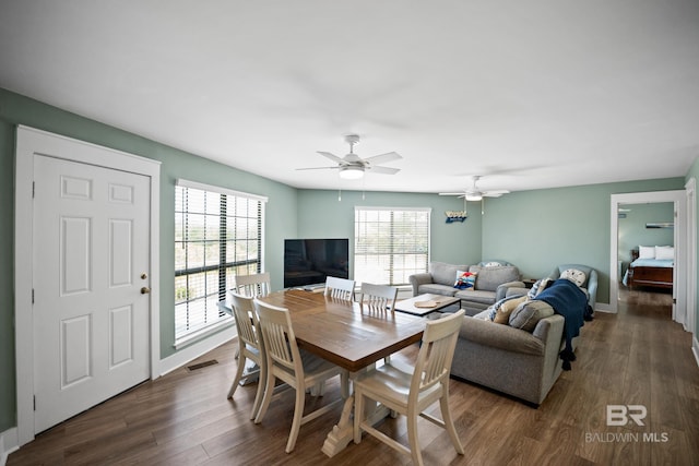 dining area featuring dark wood finished floors and ceiling fan