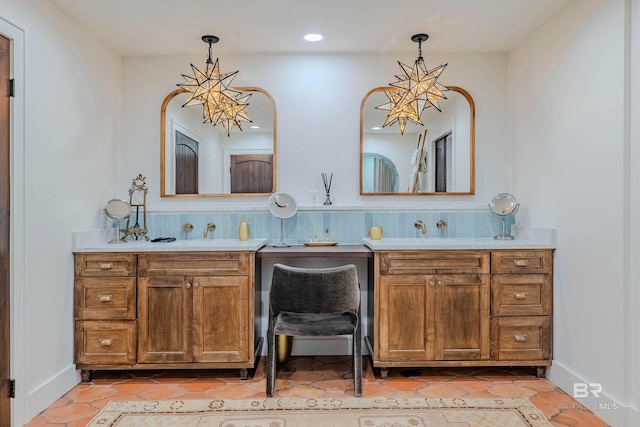 bathroom featuring vanity, tile patterned flooring, and backsplash