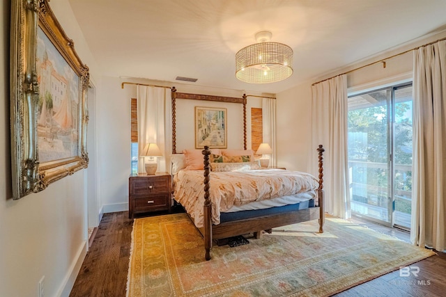 bedroom with hardwood / wood-style floors, access to exterior, and ceiling fan