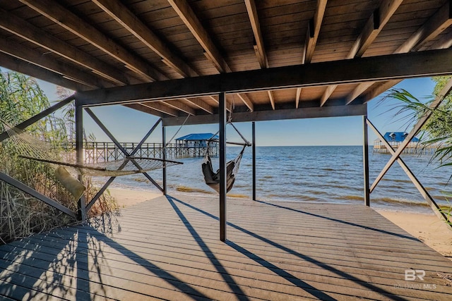 dock area featuring a view of the beach and a water view