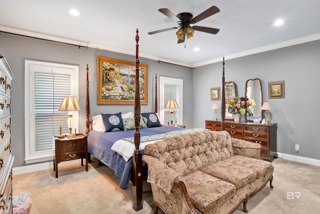 bedroom with ornamental molding, ceiling fan, and light colored carpet