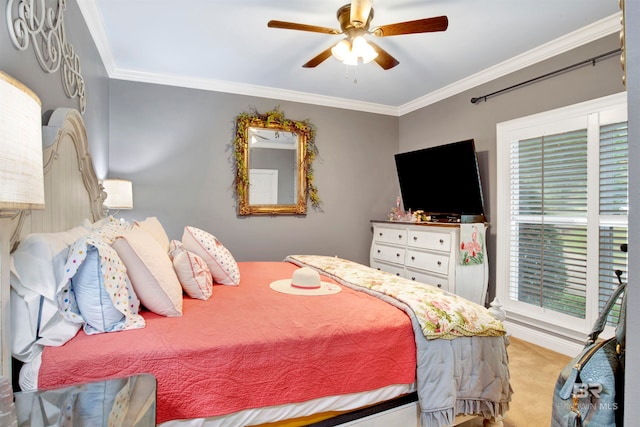 carpeted bedroom with ceiling fan and crown molding