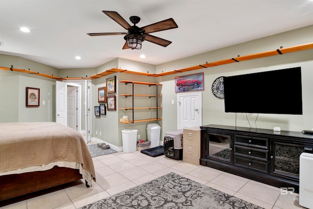 tiled bedroom featuring ceiling fan