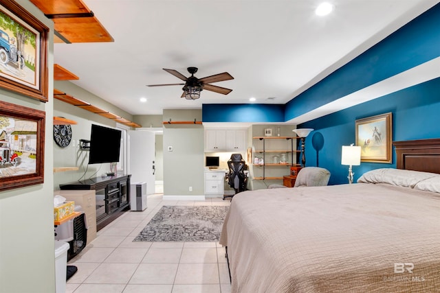 bedroom with ceiling fan and light tile patterned floors