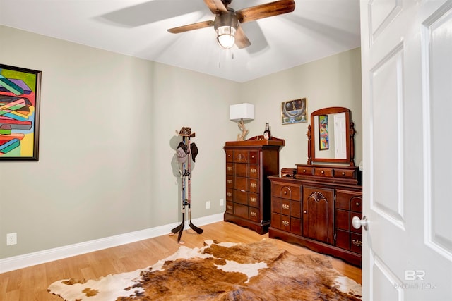 bedroom featuring light wood-type flooring and ceiling fan