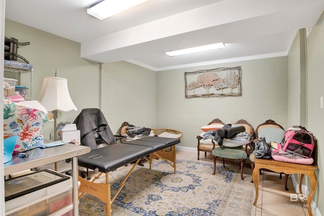 tiled home office featuring ornamental molding