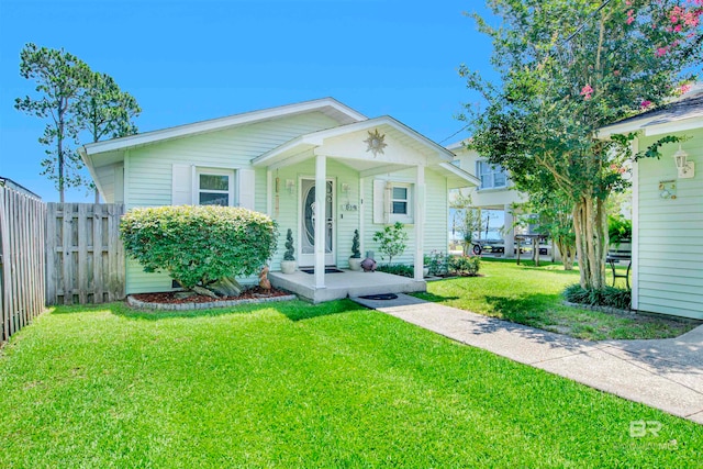 view of front of home featuring a porch and a front yard