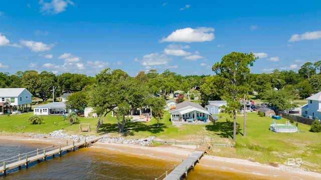 aerial view featuring a view of the beach and a water view