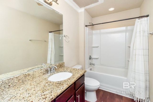 full bathroom featuring wood-type flooring, crown molding, vanity, shower / bath combo, and toilet