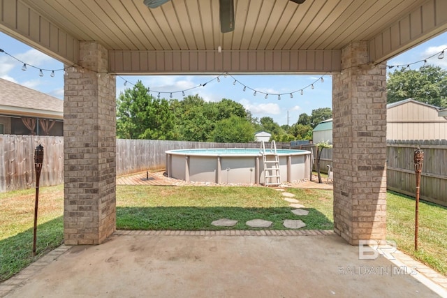 view of patio with a fenced in pool