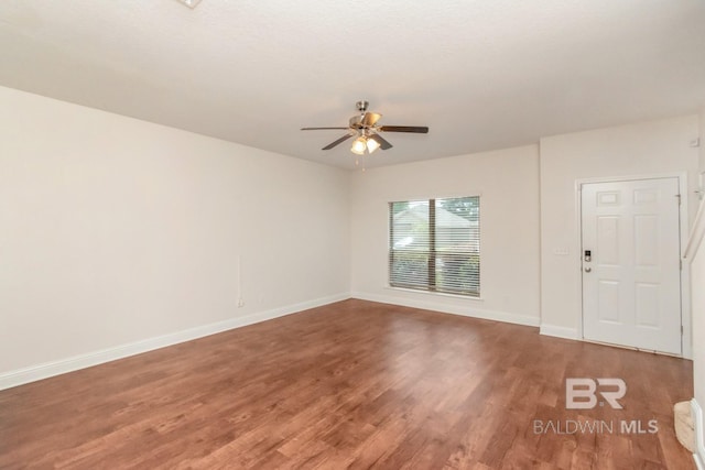 empty room featuring ceiling fan and hardwood / wood-style flooring