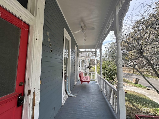 deck featuring ceiling fan and a porch