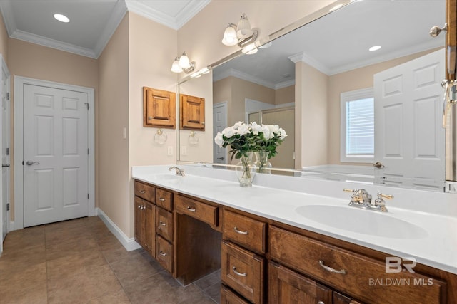 9529 Aspen Cir, Daphne, AL 36527 - bathroom featuring double vanity, ornamental molding, tile patterned flooring, baseboards, and a shower with door
