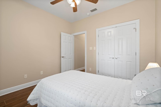 9529 Aspen Cir, Daphne, AL 36527 - bedroom with dark wood-style flooring, baseboards, a closet, and a ceiling fan
