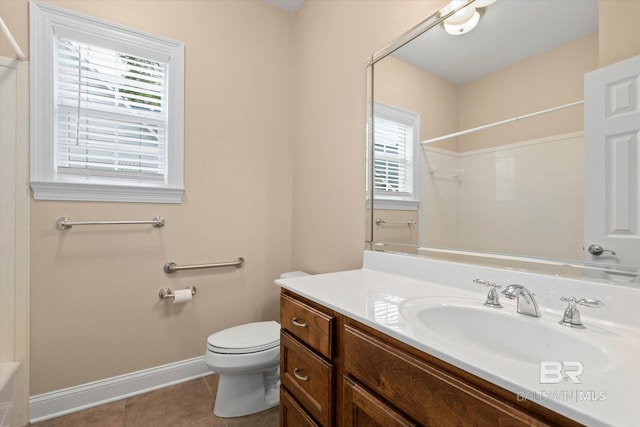 9529 Aspen Cir, Daphne, AL 36527 - full bathroom featuring vanity, a shower, toilet, tile patterned flooring, and baseboards