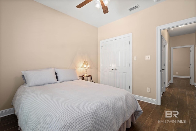 9529 Aspen Cir, Daphne, AL 36527 - bedroom featuring baseboards, dark wood finished floors, a closet, and ceiling fan
