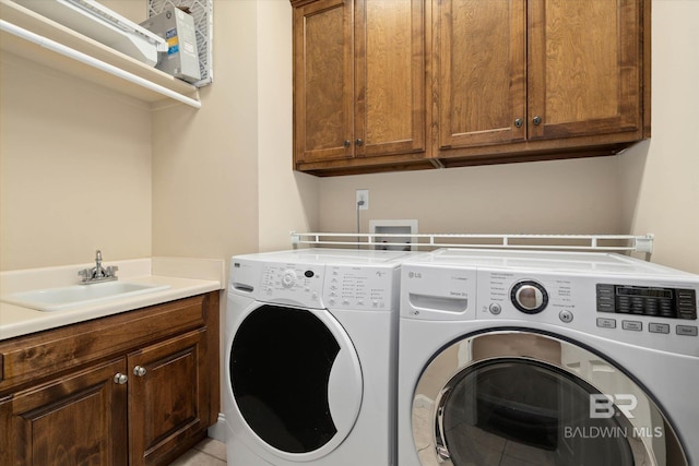 9529 Aspen Cir, Daphne, AL 36527 - laundry room featuring washing machine and dryer and cabinet space