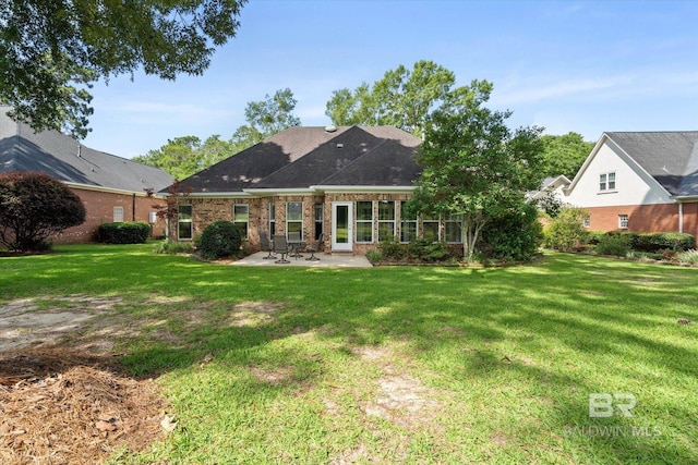 9529 Aspen Cir, Daphne, AL 36527 - back of house featuring a patio area, a lawn, and brick siding
