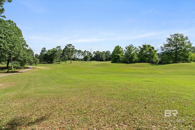 9529 Aspen Cir, Daphne, AL 36527 - view of grassy yard with view of golf course and view of wooded area