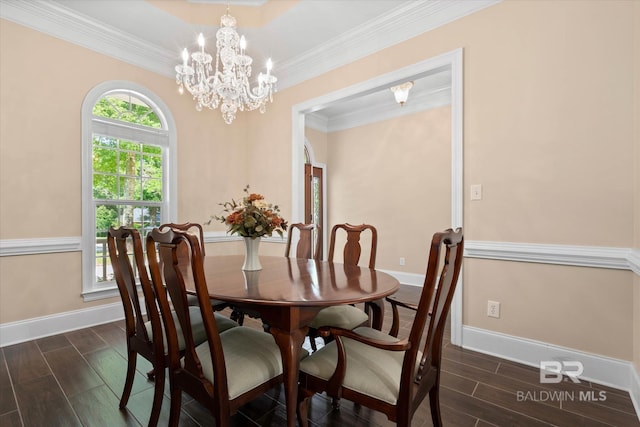 9529 Aspen Cir, Daphne, AL 36527 - dining room featuring dark wood-type flooring, baseboards, crown molding, and a chandelier