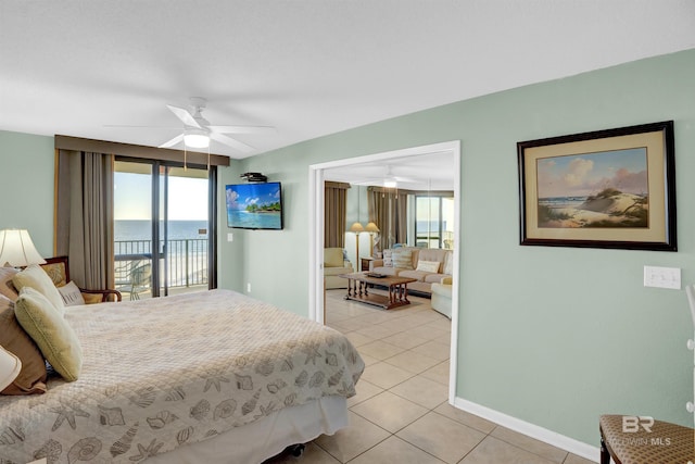 bedroom with ceiling fan, light tile patterned floors, and access to outside