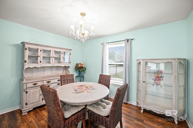 2553 Santa Rosa Dr, Lillian, AL 36549 - dining room featuring a chandelier, dark wood-type flooring, and baseboards