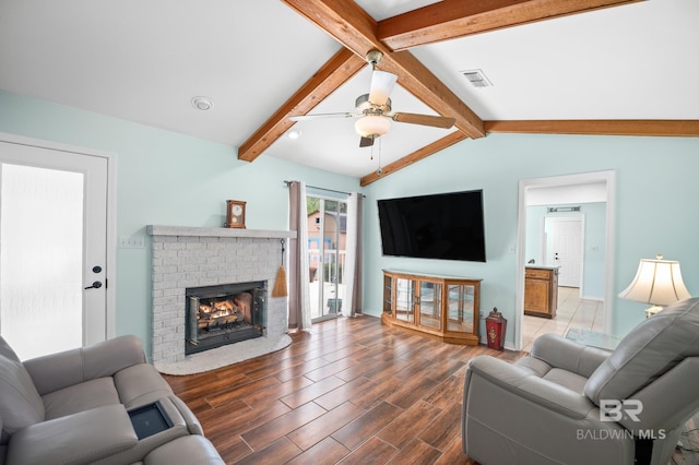 2553 Santa Rosa Dr, Lillian, AL 36549 - living area with a ceiling fan, wood finished floors, and a brick fireplace