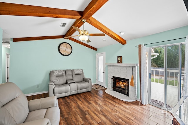2553 Santa Rosa Dr, Lillian, AL 36549 - living area with wood finished floors, baseboards, a fireplace, and a ceiling fan