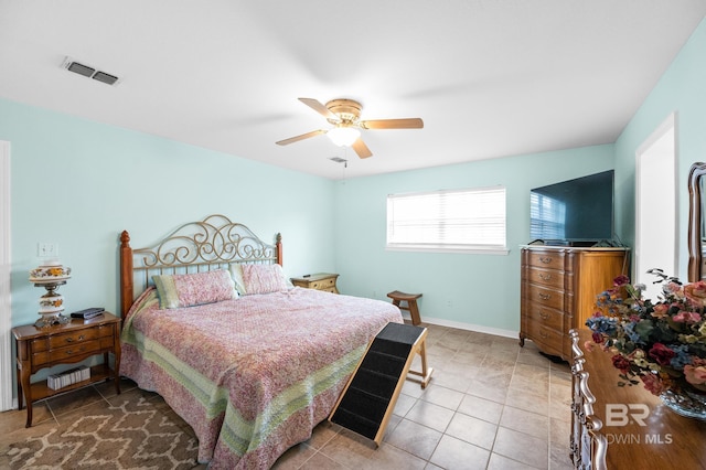 2553 Santa Rosa Dr, Lillian, AL 36549 - tiled bedroom featuring a ceiling fan and baseboards