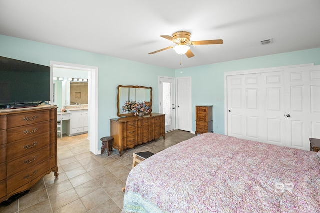 2553 Santa Rosa Dr, Lillian, AL 36549 - bedroom featuring a closet, light tile patterned flooring, a ceiling fan, and connected bathroom