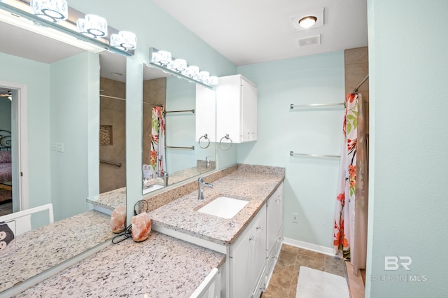 2553 Santa Rosa Dr, Lillian, AL 36549 - full bathroom featuring baseboards, vanity, and a shower with curtain